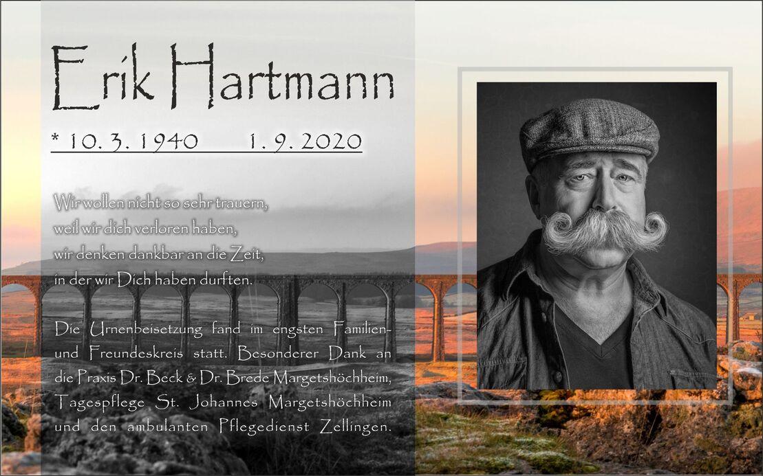 Bild eines Nachrufs f&uuml;r Erik Hartmann mit Lebensdaten und pers&ouml;nlicher Botschaft unter einem sanften Landschaftshintergrund.