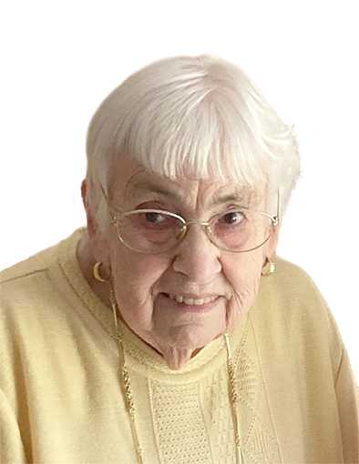 Portr&auml;t einer &auml;lteren Frau mit kurzen, wei&szlig;en Haaren und Brille, die in einem hellgelben Pullover l&auml;chelt.