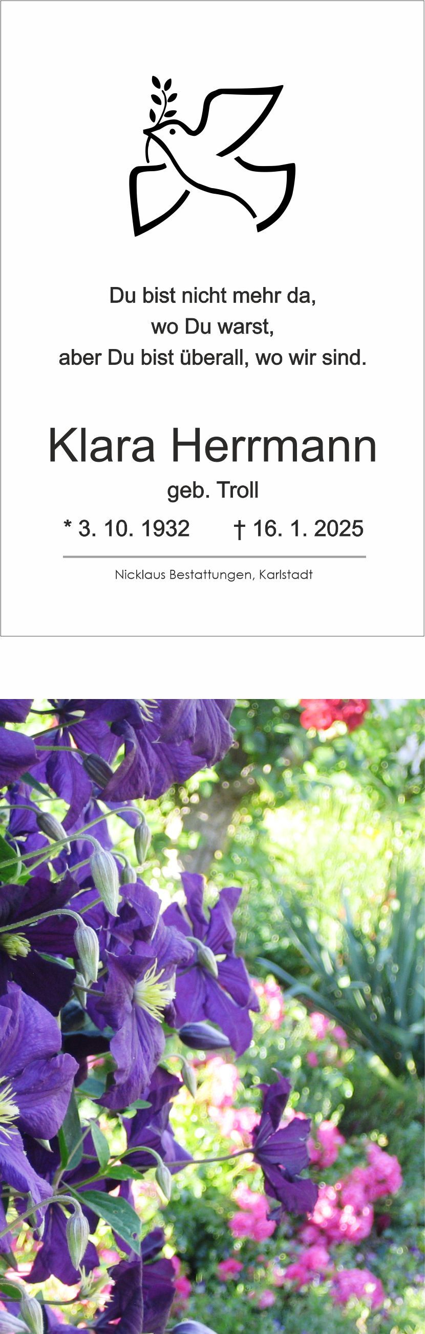 Grabkarte mit Text und Abbildung einer Taube, umgeben von bunten Blumen, darunter lila Clematis.