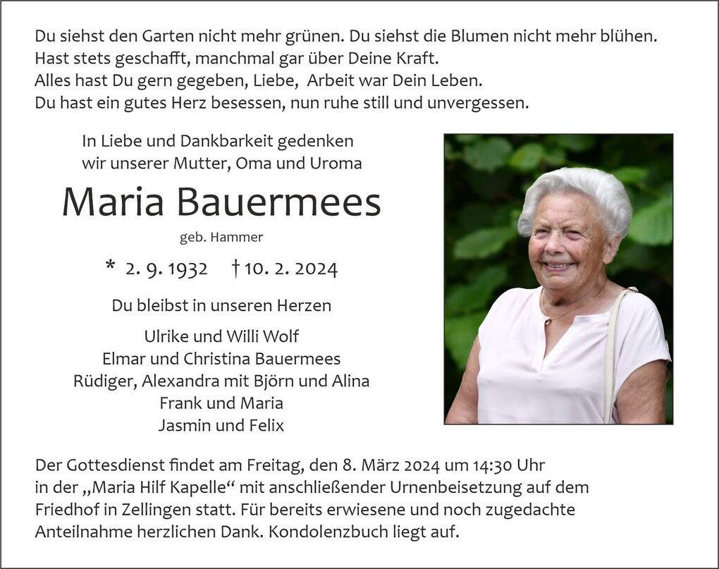 Sterbebild f&uuml;r Maria Bauermees mit Foto einer l&auml;chelnden &auml;lteren Frau, umgeben von gr&uuml;nen Pflanzen, und Inschriften zur Trauerfeier.