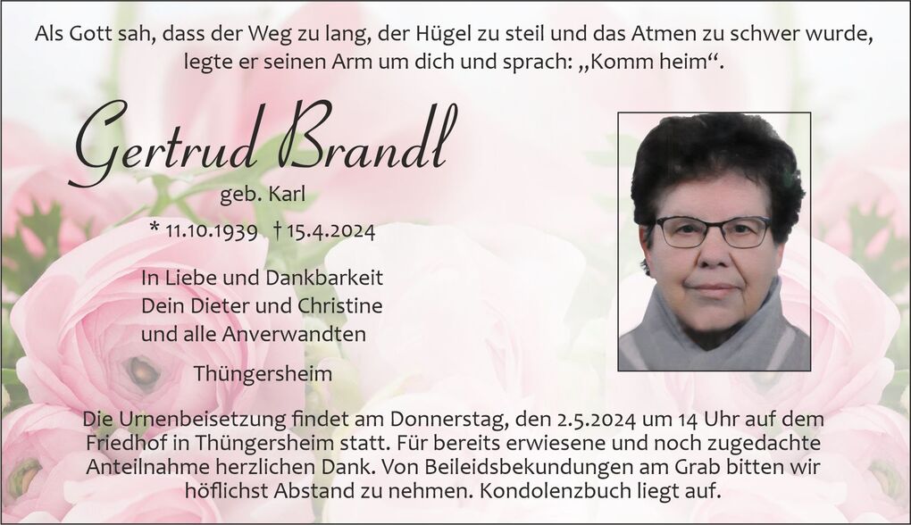 Traueranzeige f&uuml;r Gertrud Brandl mit Foto, Geburts- und Sterbedatum sowie Details zur Urnenbeisetzung. Rosen im Hintergrund.