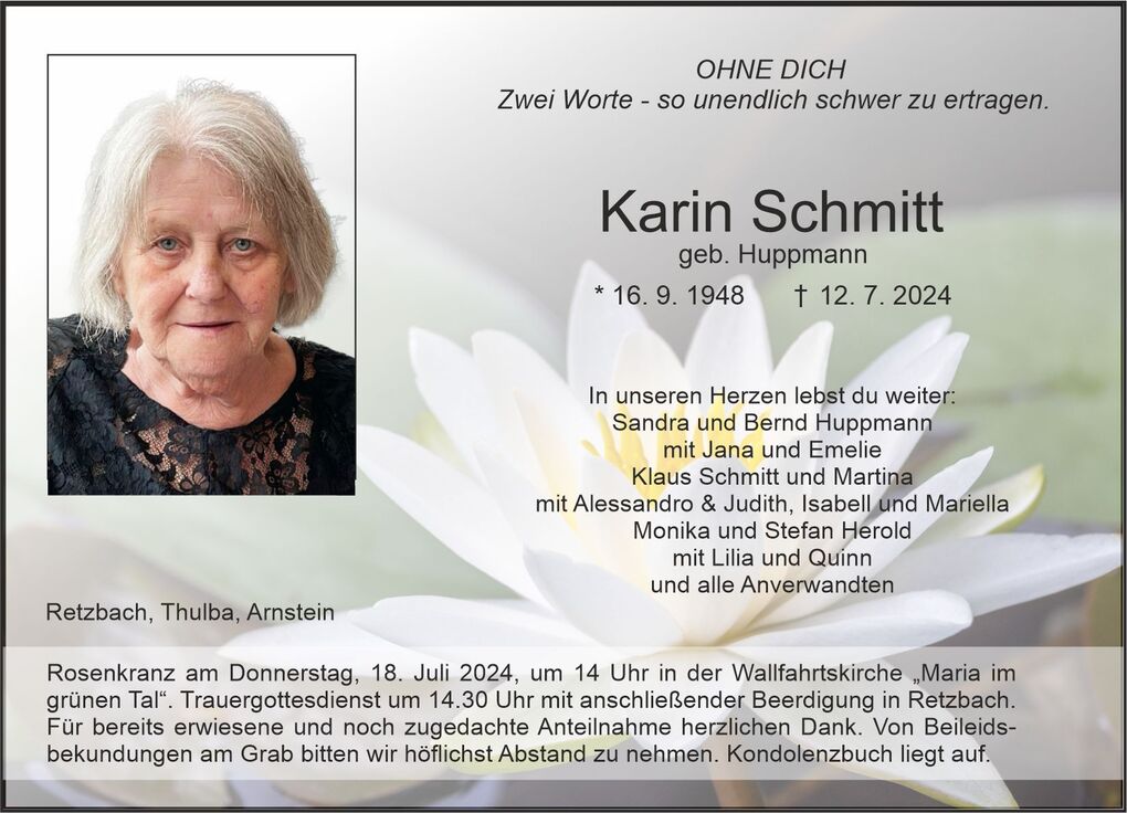 Traueranzeige f&uuml;r Karin Schmitt mit Portr&auml;tfoto und Rosenbl&uuml;te im Hintergrund, Details zur Trauerfeier.
