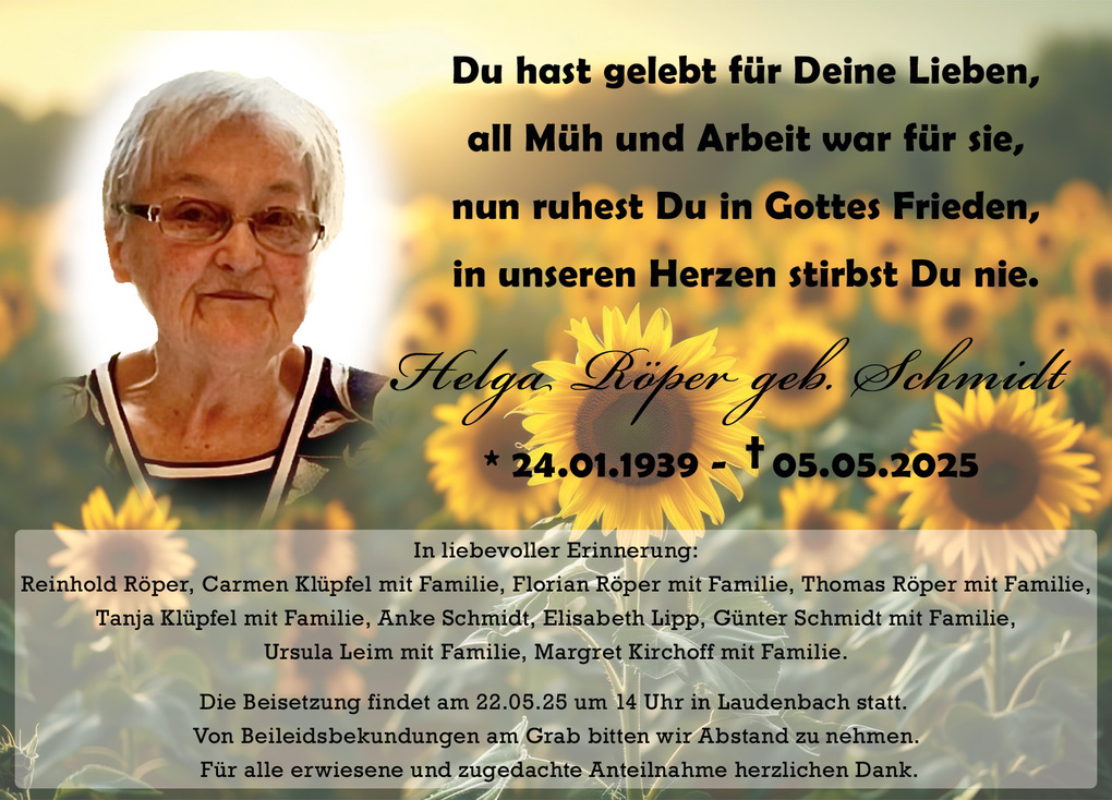 Portr&auml;t einer &auml;lteren Frau mit Brille, umgeben von Sonnenblumen, mit Dankestext und Beisetzungsinformationen im Hintergrund.